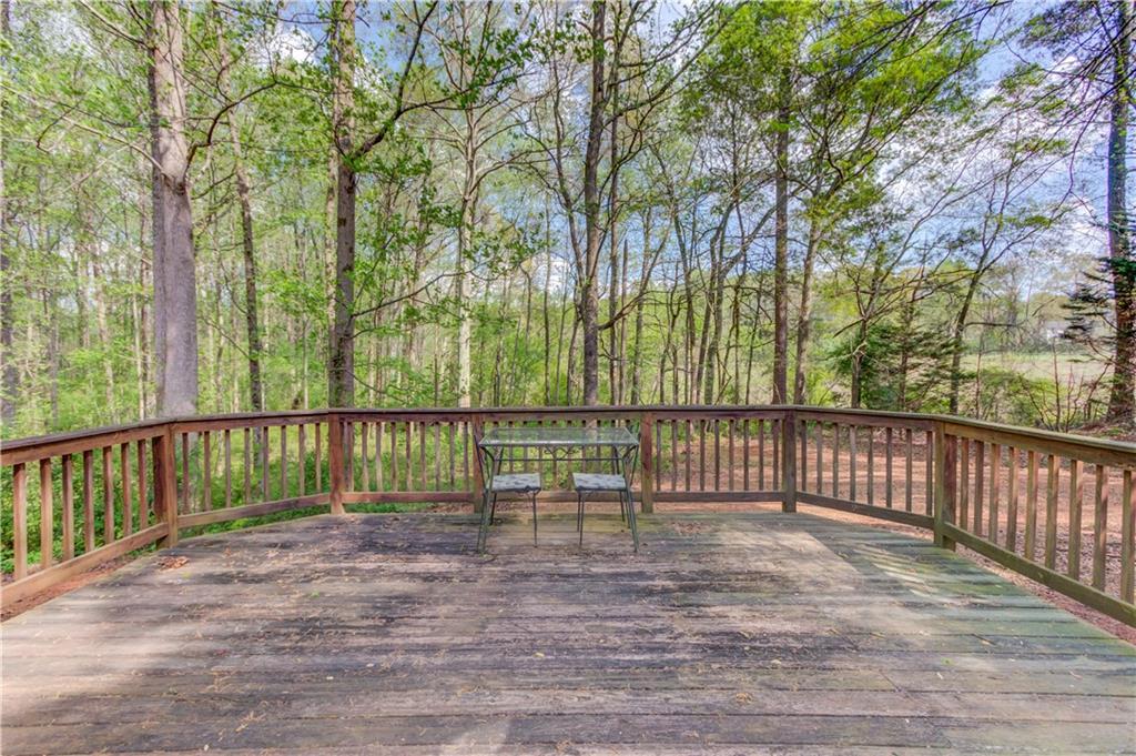 925 Nature Trail Bethlehem, GA 30620 - Photo 30 of 41 a view of deck with a chair and floor