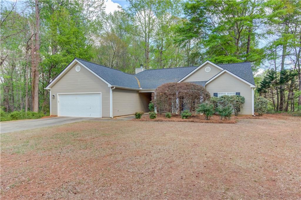 925 Nature Trail Bethlehem, GA 30620 - Photo 3 of 41 front view of a house with a yard and trees