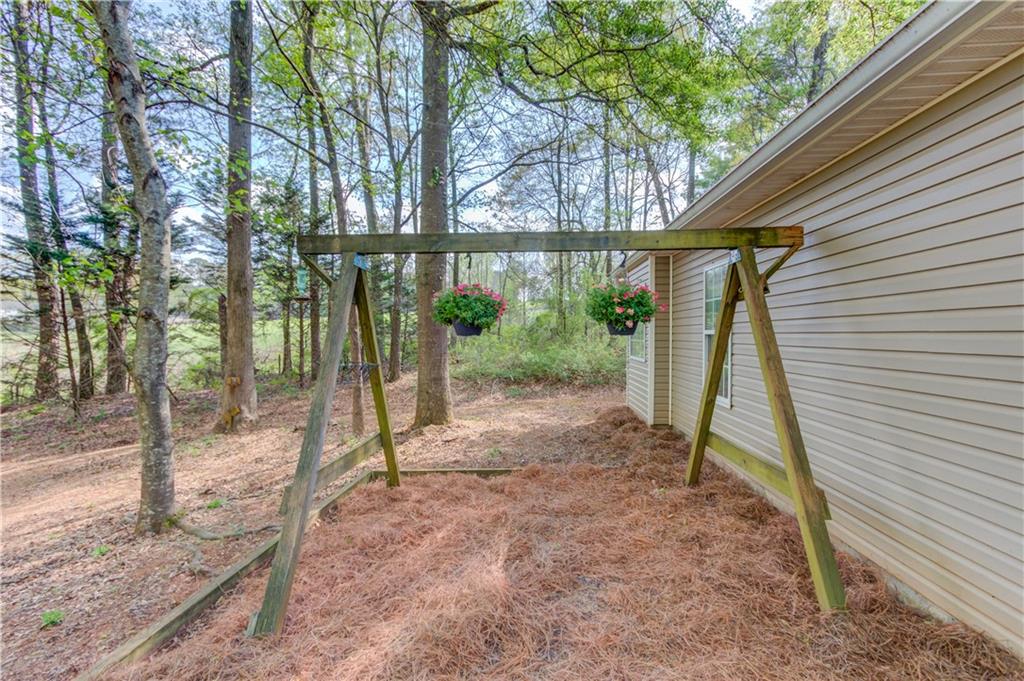 925 Nature Trail Bethlehem, GA 30620 - Photo 32 of 41 a view of a house with a backyard