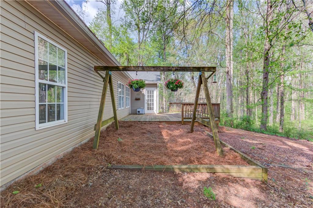 925 Nature Trail Bethlehem, GA 30620 - Photo 34 of 41 a view of a backyard with a large tree