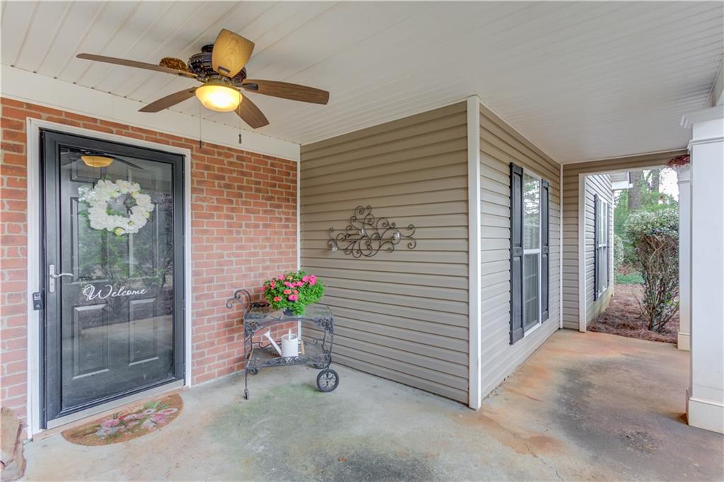 925 Nature Trail Bethlehem, GA 30620 - Photo 5 of 41 a view of a livingroom with a potted plant on the wall