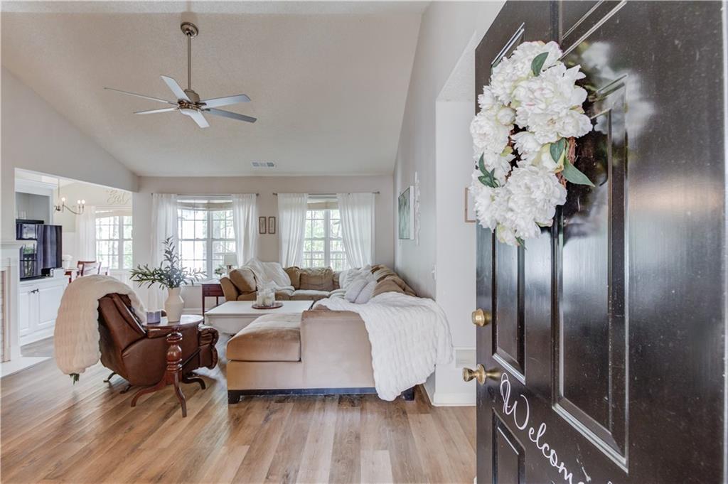 925 Nature Trail Bethlehem, GA 30620 - Photo 6 of 41 a living room with furniture chandelier and a chandelier