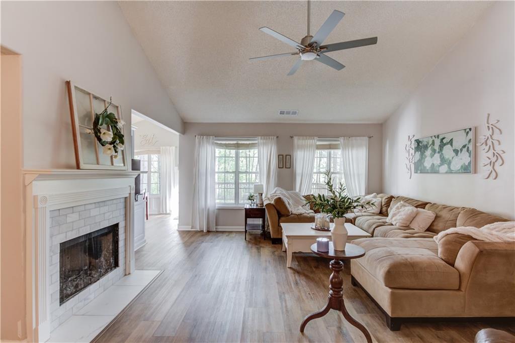 925 Nature Trail Bethlehem, GA 30620 - Photo 8 of 41 a living room with furniture and a fireplace