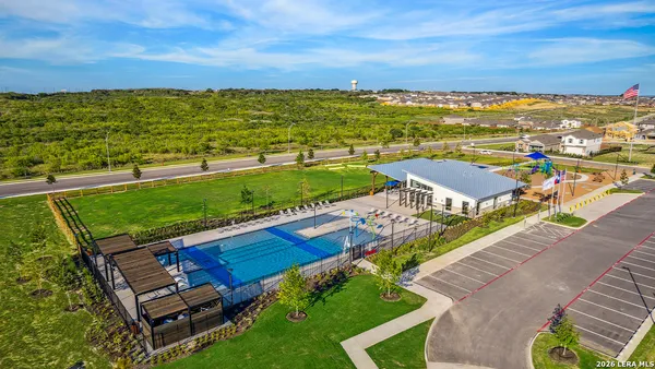 a view of a swimming pool with a patio