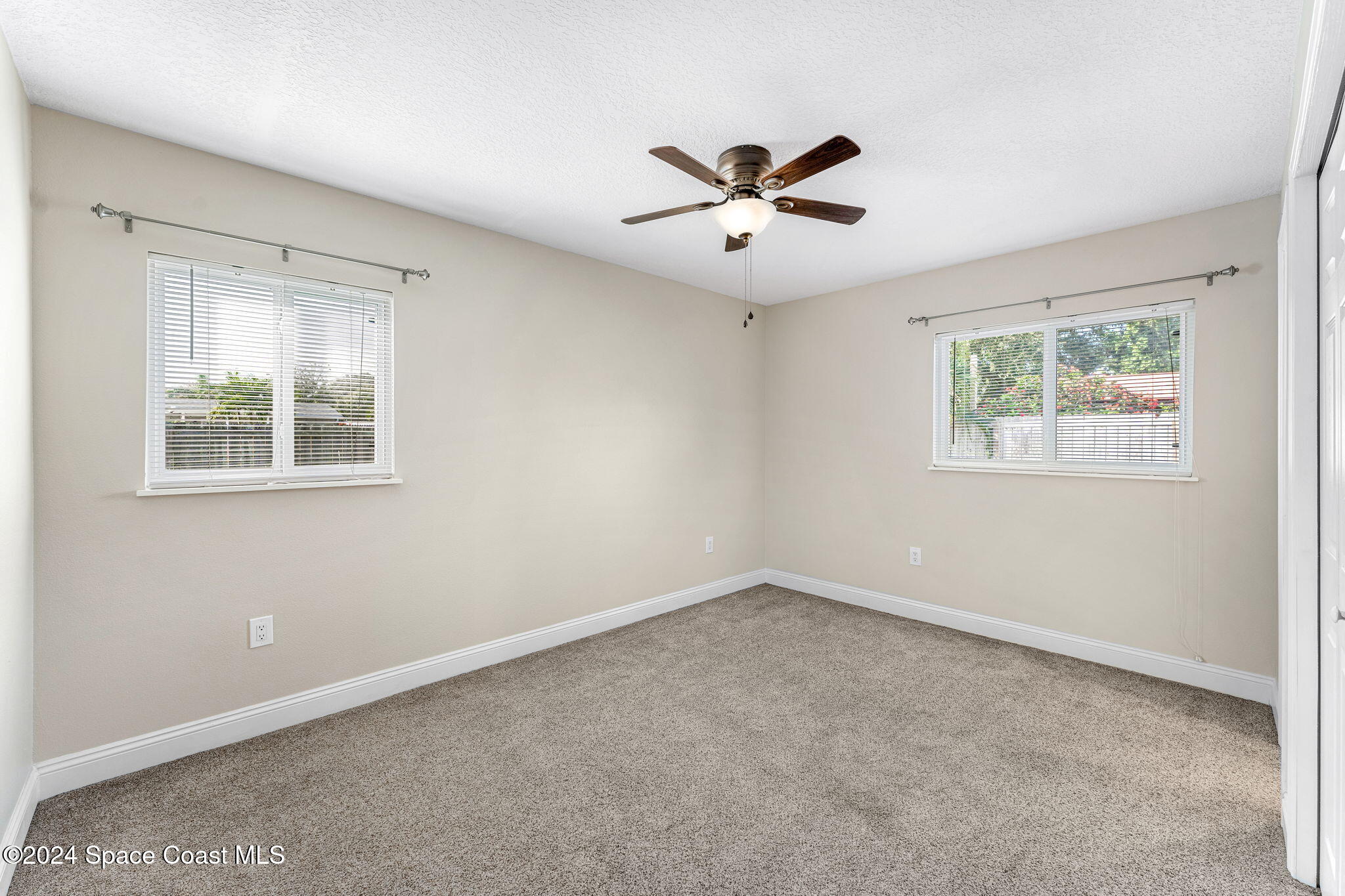 5120 Sutton Avenue Melbourne, FL 32904 - Photo 16 of 38 a view of an empty room with a window
