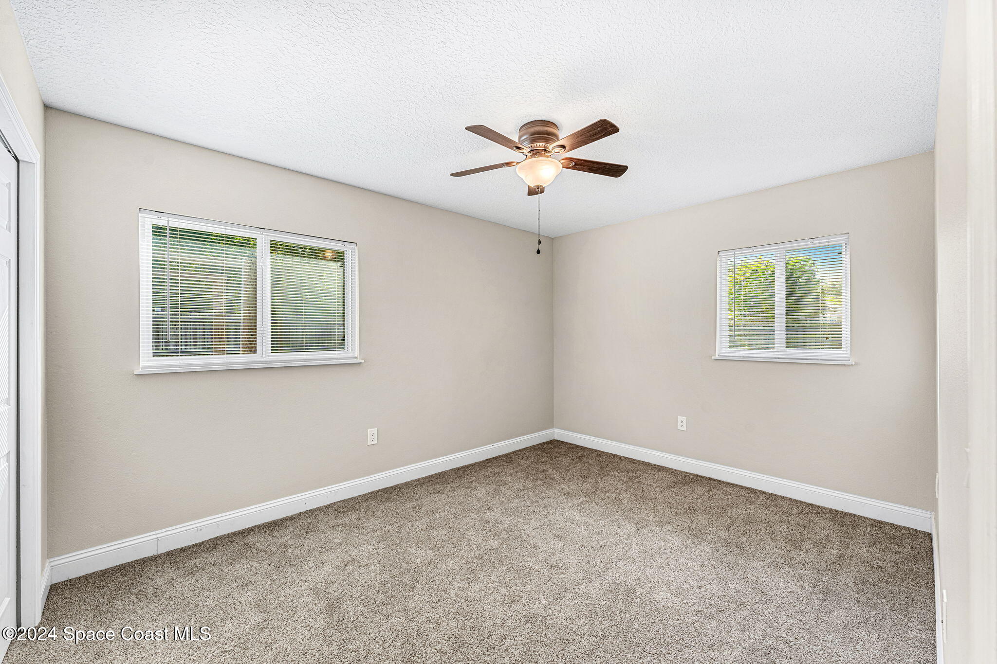 5120 Sutton Avenue Melbourne, FL 32904 - Photo 18 of 38 a view of an empty room with a window