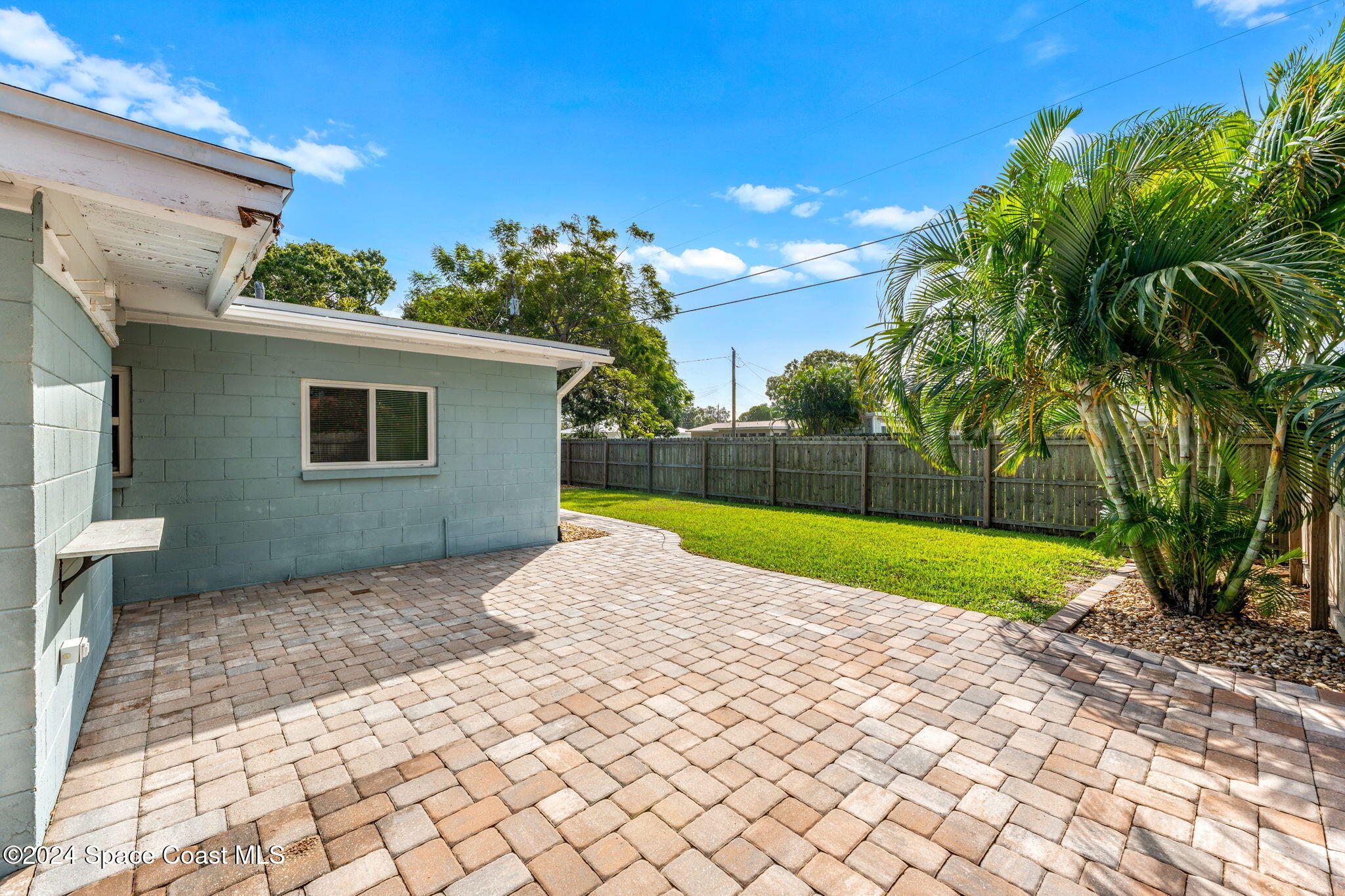 5120 Sutton Avenue Melbourne, FL 32904 - Photo 22 of 38 a view of backyard of house and trees