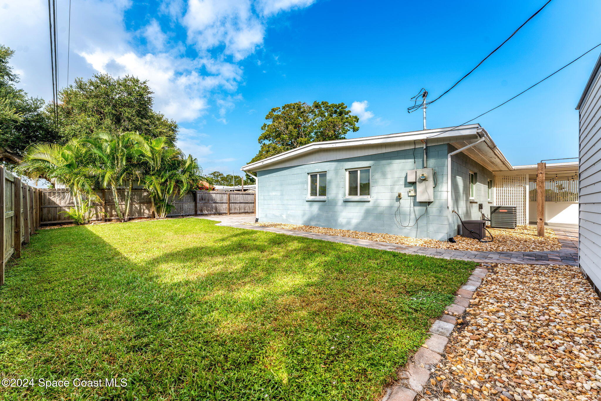 5120 Sutton Avenue Melbourne, FL 32904 - Photo 25 of 38 a view of house with a yard