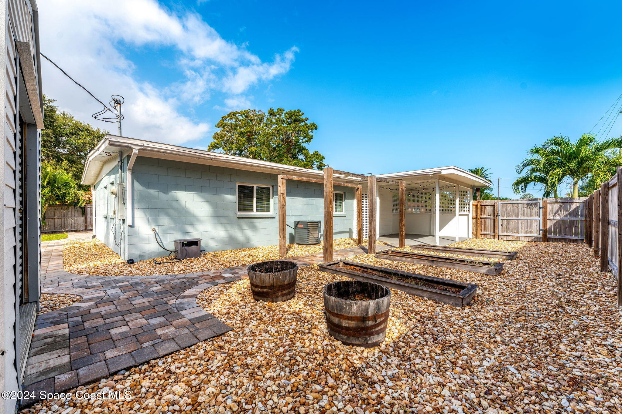 5120 Sutton Avenue Melbourne, FL 32904 - Photo 26 of 38 a front view of house with yard and seating space