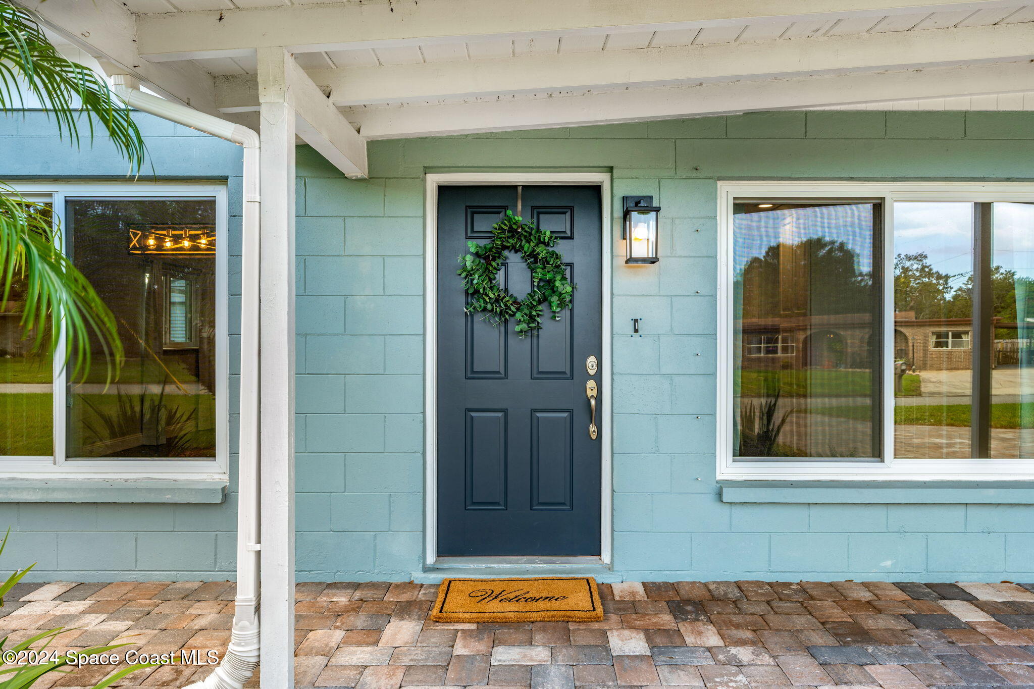 5120 Sutton Avenue Melbourne, FL 32904 - Photo 3 of 38 a view of a door of the house with a outdoor space
