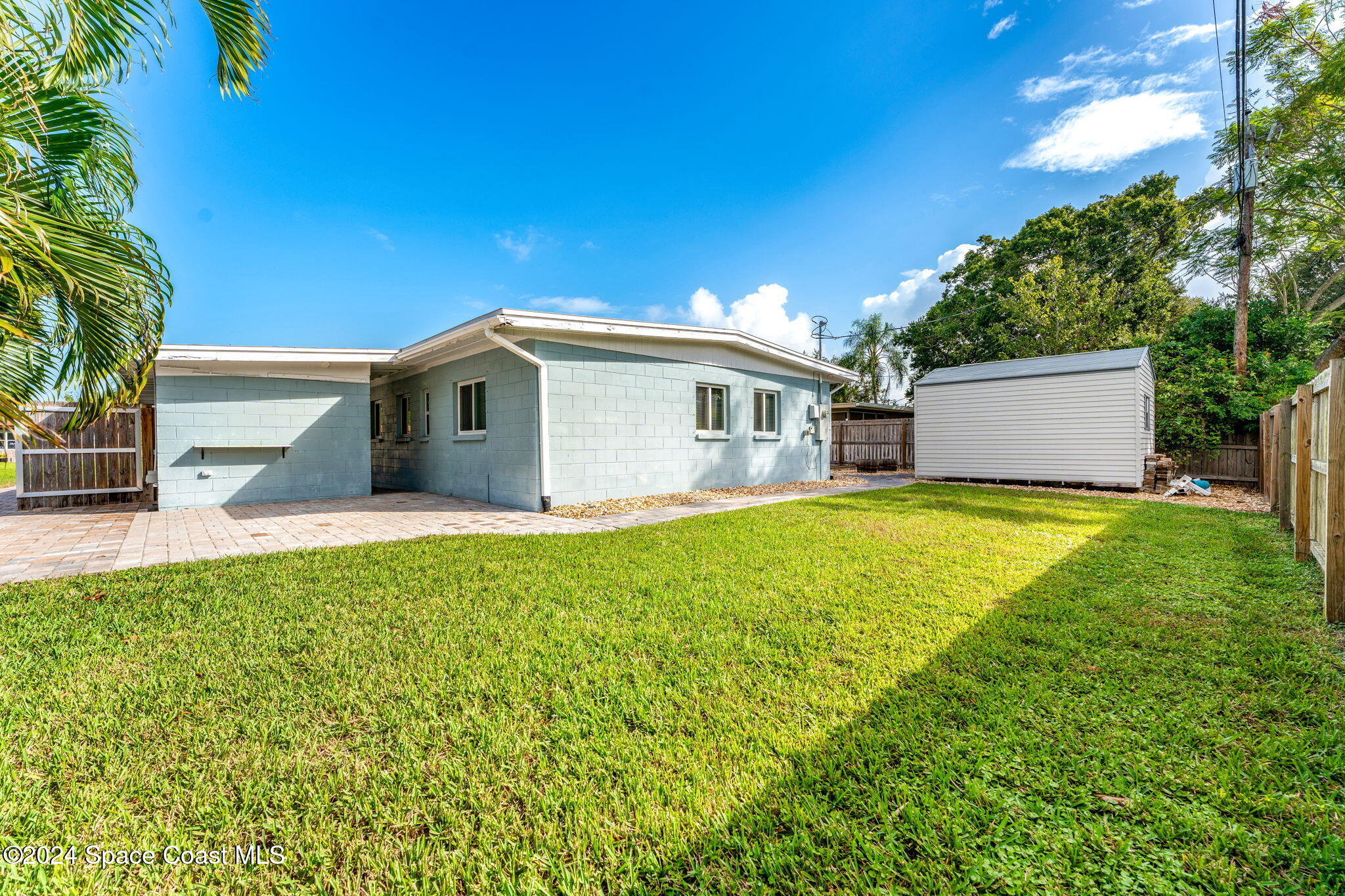 5120 Sutton Avenue Melbourne, FL 32904 - Photo 32 of 38 a view of a house with a backyard