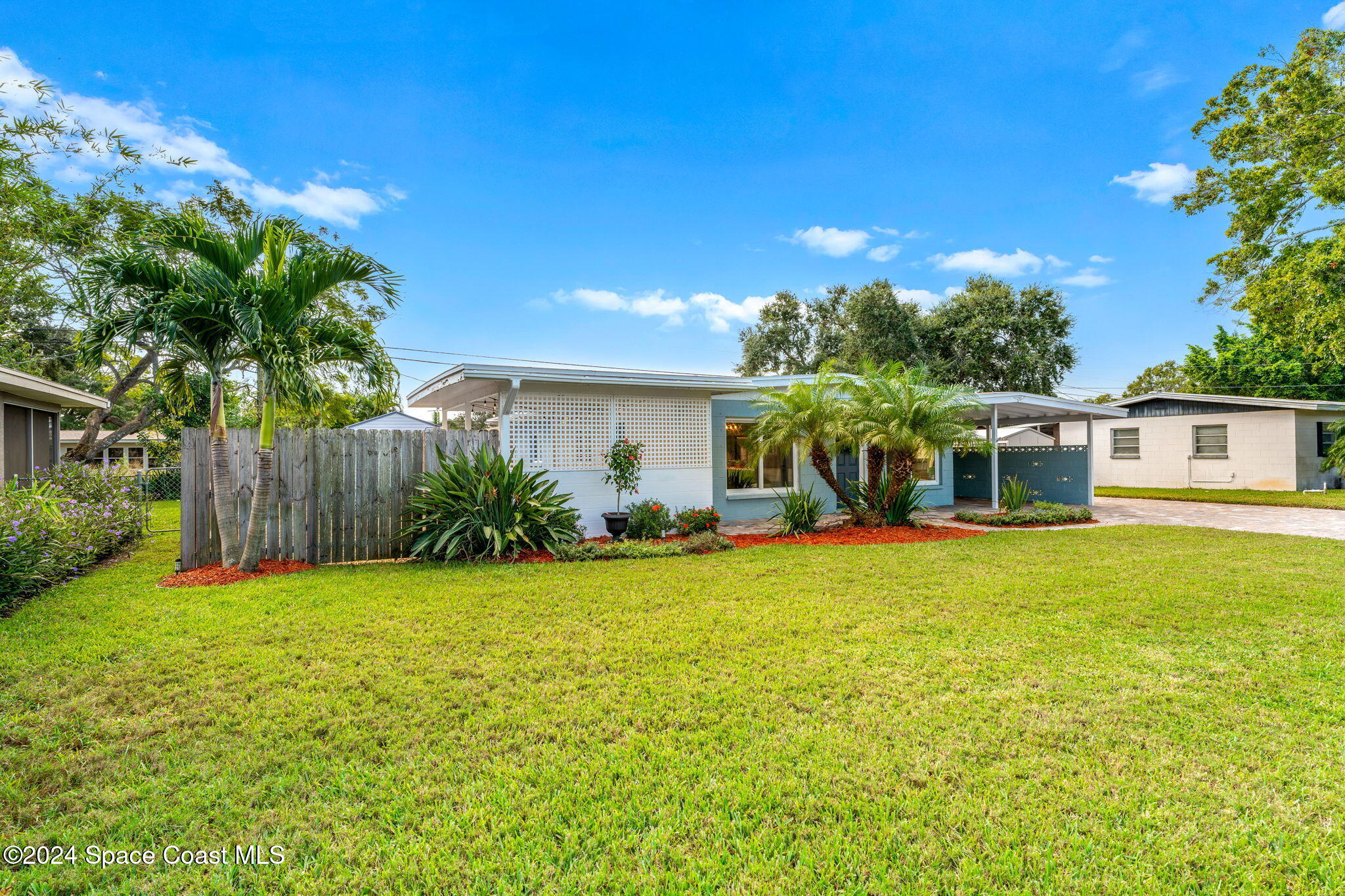5120 Sutton Avenue Melbourne, FL 32904 - Photo 33 of 38 a front view of a house with garden