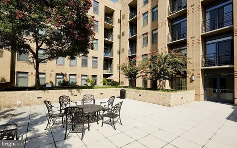 a swimming pool with outdoor seating