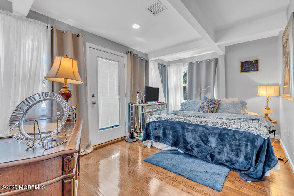 19 Gravelly Point Road Highlands, NJ 07732 - Photo 22 of 44 a living room with a bed furniture and a window