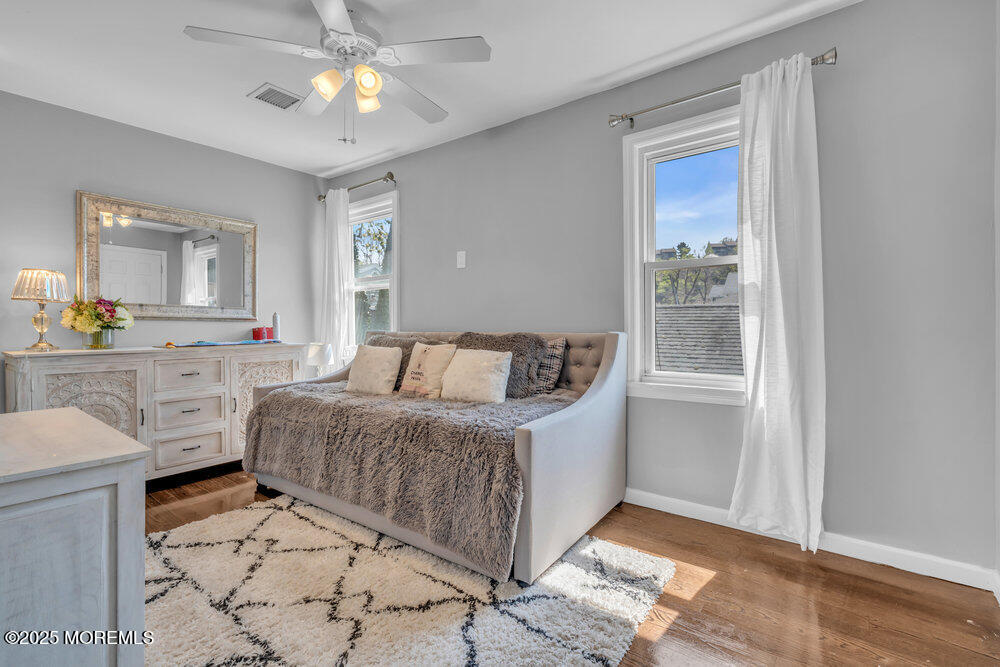 19 Gravelly Point Road Highlands, NJ 07732 - Photo 25 of 44 a living room with furniture and a chandelier