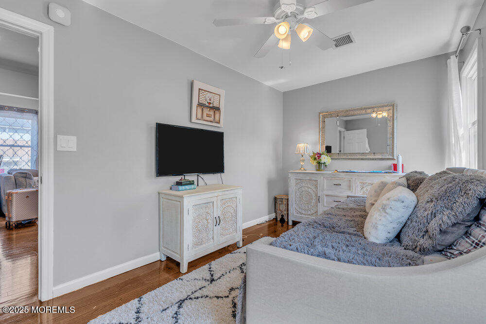 19 Gravelly Point Road Highlands, NJ 07732 - Photo 26 of 44 a living room with furniture and a flat screen tv