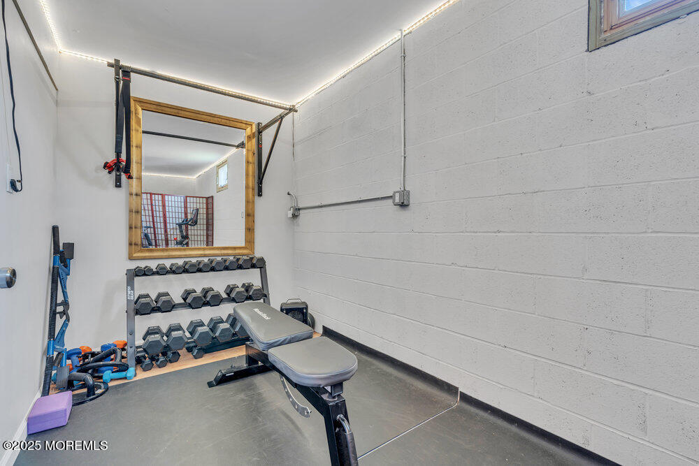 19 Gravelly Point Road Highlands, NJ 07732 - Photo 30 of 44 a bathroom with a mirror and a shower