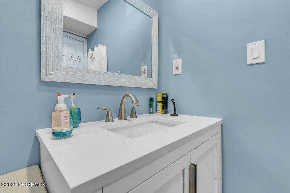 19 Gravelly Point Road Highlands, NJ 07732 - Photo 32 of 44 a bathroom with a sink and a mirror