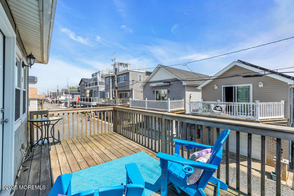 19 Gravelly Point Road Highlands, NJ 07732 - Photo 8 of 44 a view of a balcony with chairs