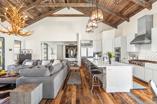 a bathroom with a granite countertop sink mirror vanity and toilet