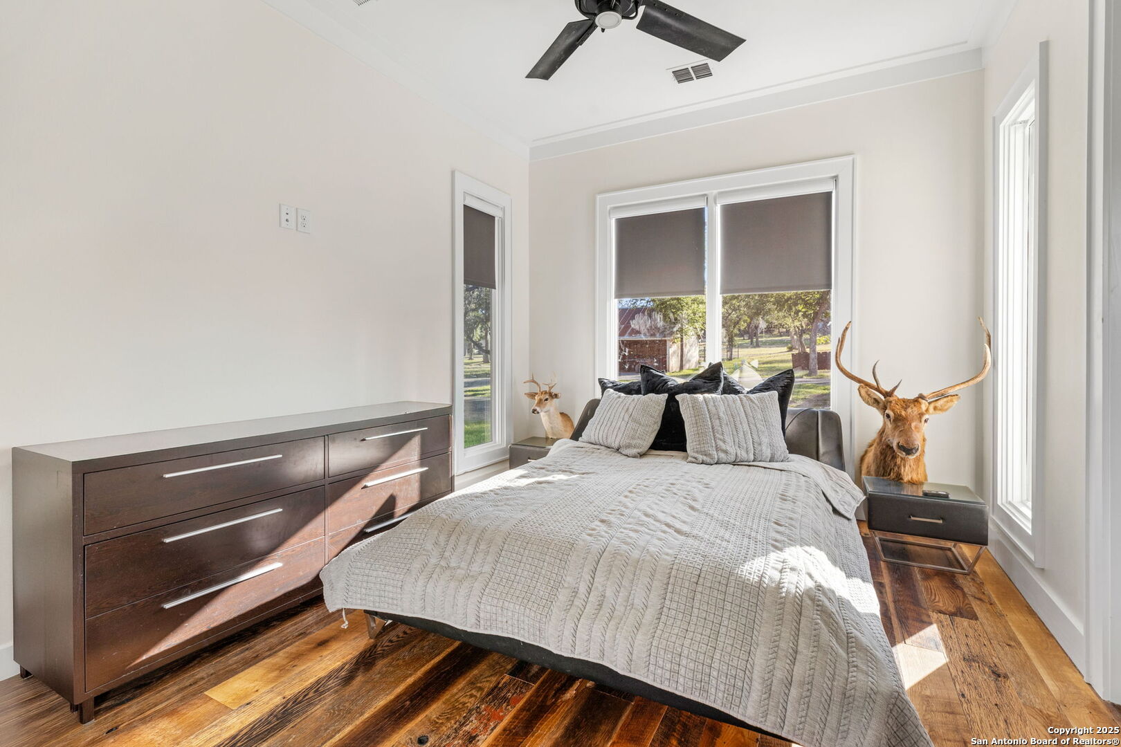 1146 Sisterdale Road Boerne, TX 78006 - Photo 18 of 94 a bedroom with a bed and a window