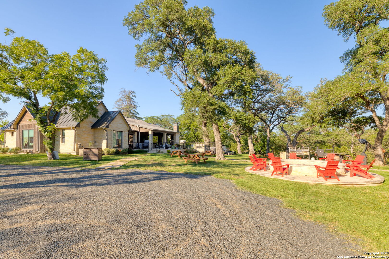 1146 Sisterdale Road Boerne, TX 78006 - Photo 31 of 94 a front view of a house with a yard and trees