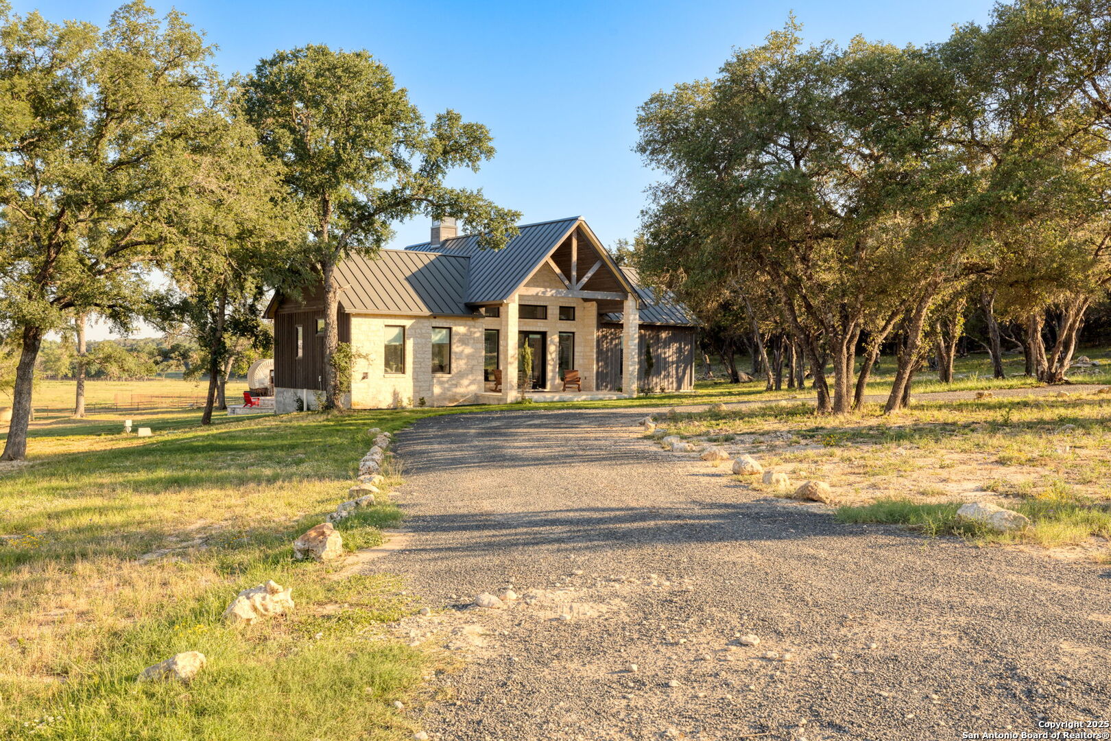 1146 Sisterdale Road Boerne, TX 78006 - Photo 32 of 94 a view of a house with a yard and large trees