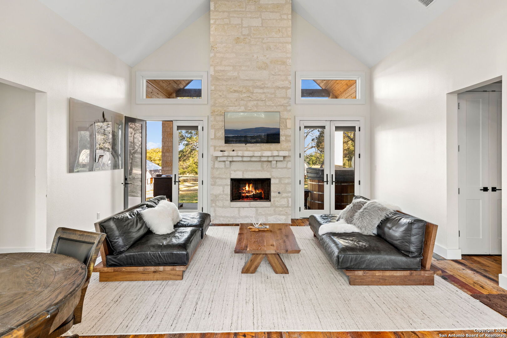 1146 Sisterdale Road Boerne, TX 78006 - Photo 33 of 94 a living room with furniture and a fireplace