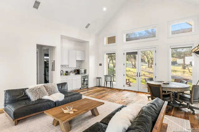 a view of a roof deck with chair and wooden floor