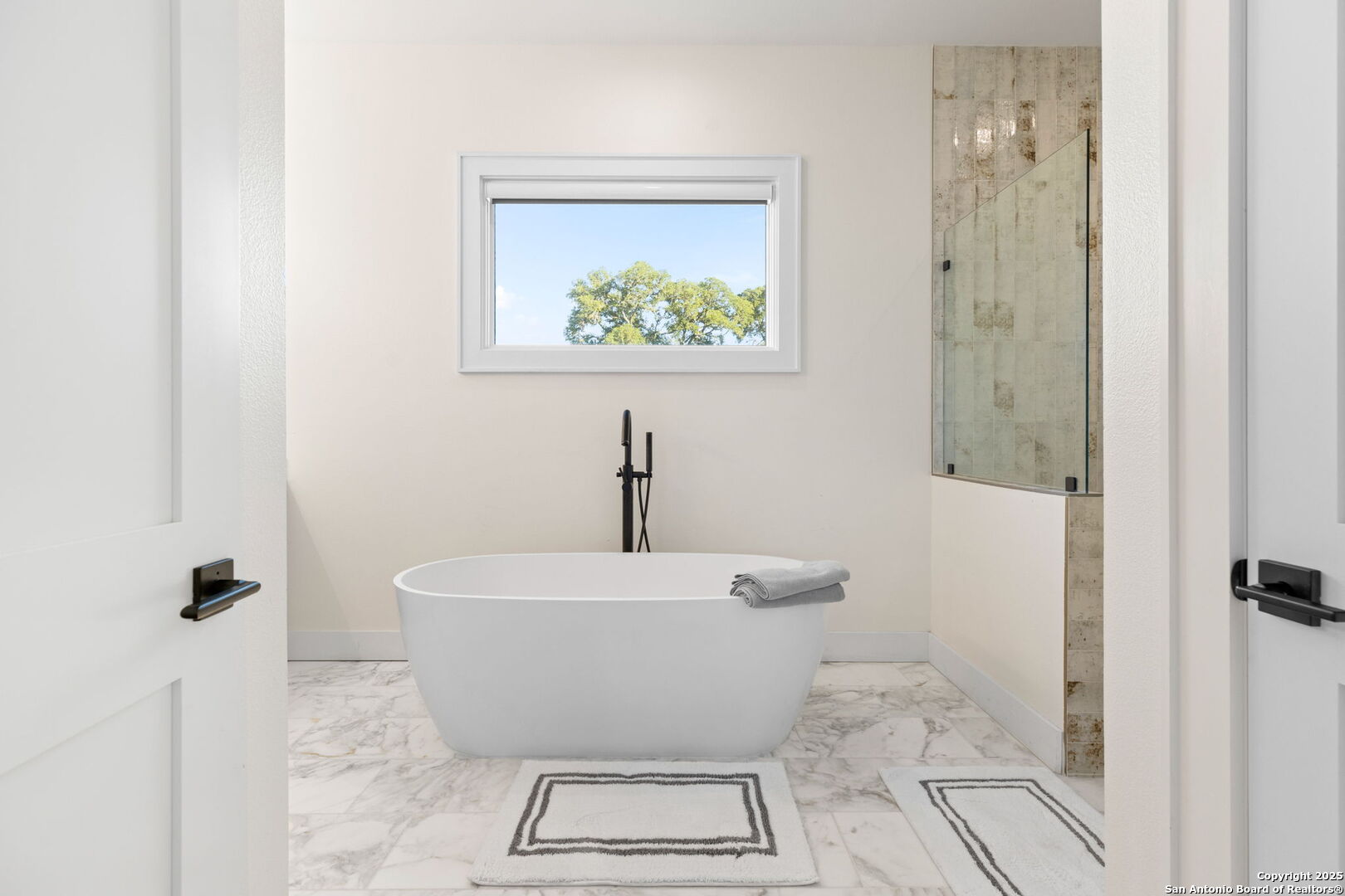 1146 Sisterdale Road Boerne, TX 78006 - Photo 39 of 94 a white bath tub sitting next to a white toilet