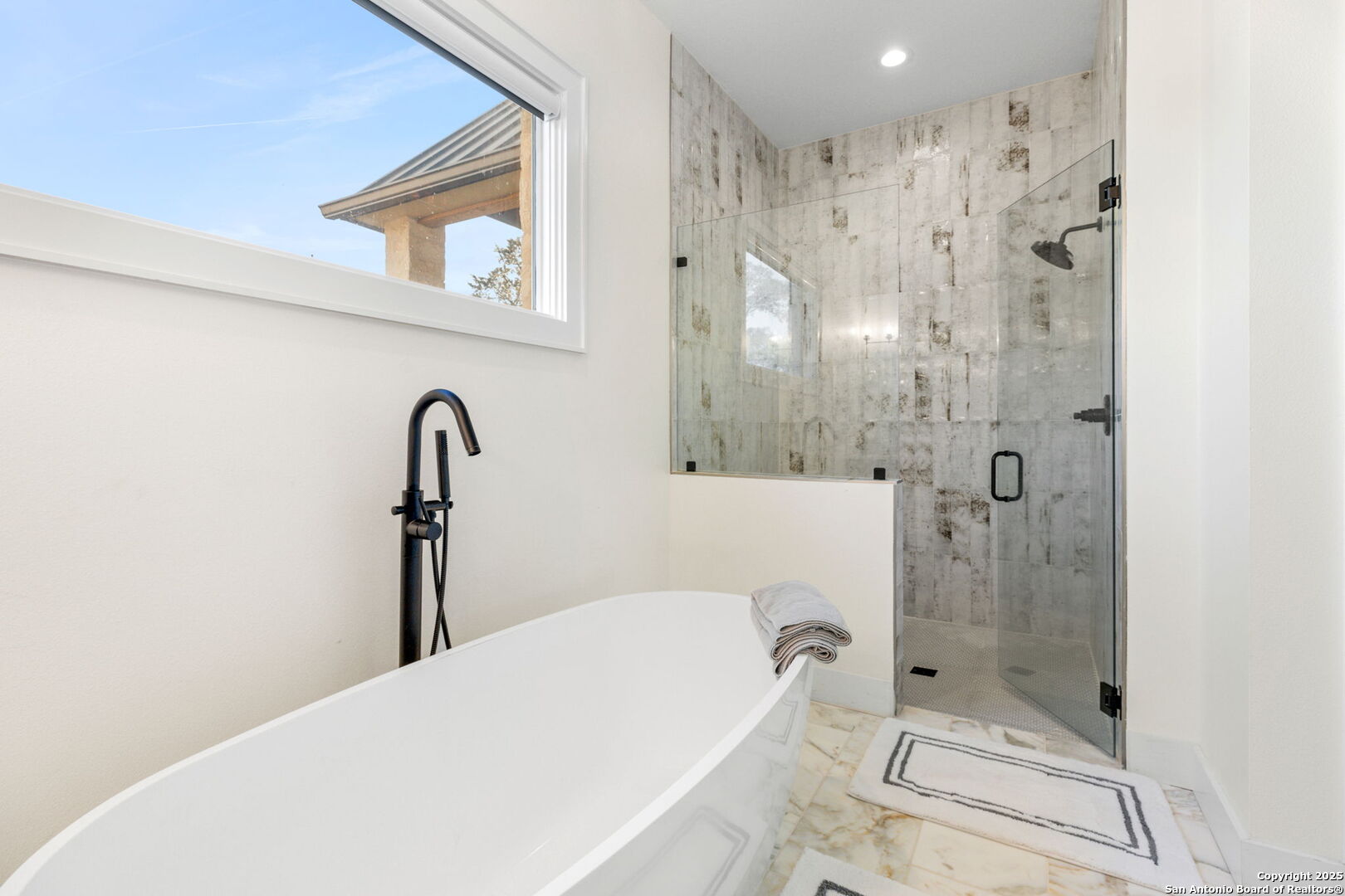 1146 Sisterdale Road Boerne, TX 78006 - Photo 41 of 94 a bathroom with a bathtub and a shower