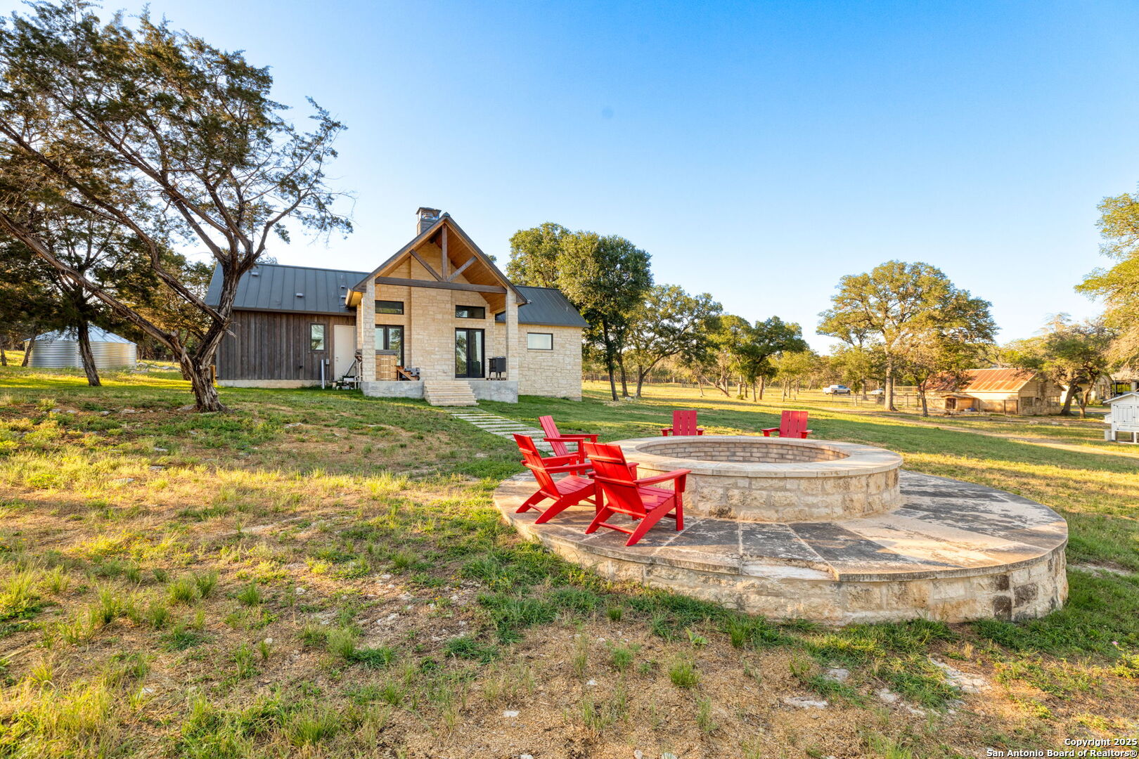 1146 Sisterdale Road Boerne, TX 78006 - Photo 44 of 94 a view of a house with a yard