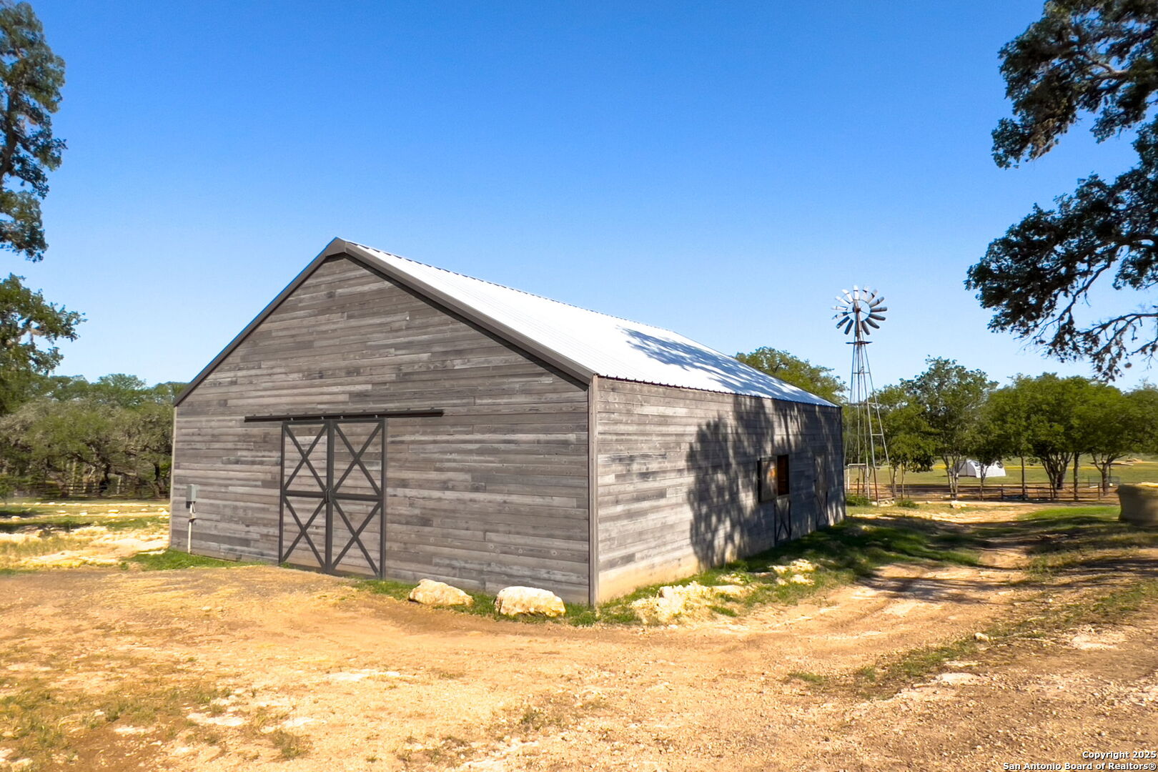 1146 Sisterdale Road Boerne, TX 78006 - Photo 48 of 94 a view of a house with a snow in the yard