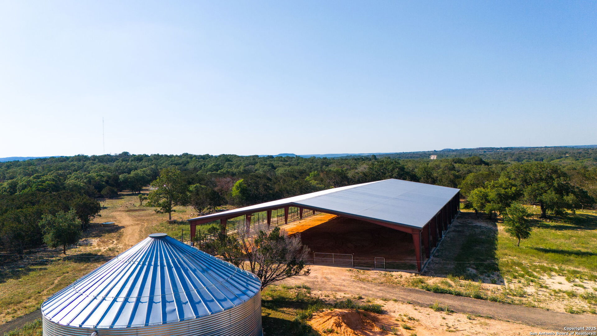 1146 Sisterdale Road Boerne, TX 78006 - Photo 53 of 94 a view of a roof deck with chair and wooden floor