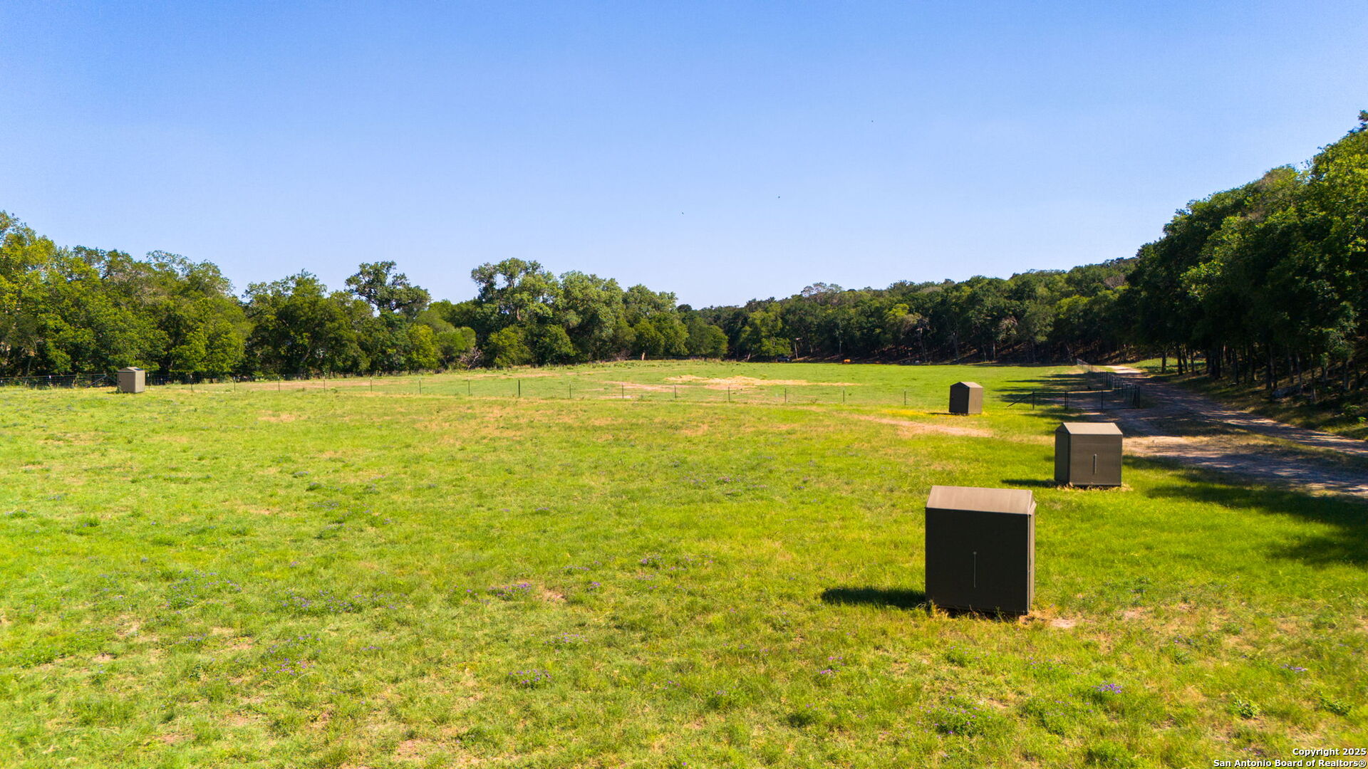 1146 Sisterdale Road Boerne, TX 78006 - Photo 78 of 94 a view of a lake with houses in the back