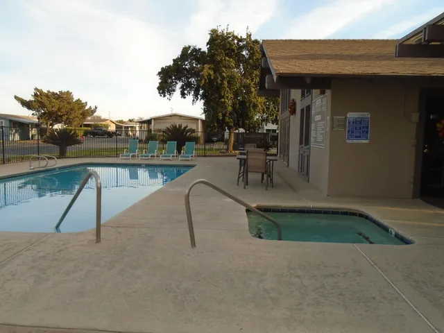 a view of swimming pool with a bench