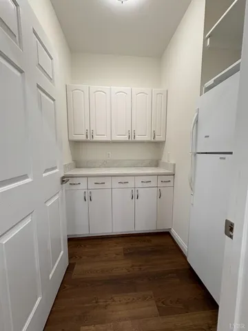 a view of a livingroom with a ceiling fan and window