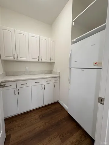 a view of an empty room with a ceiling fan