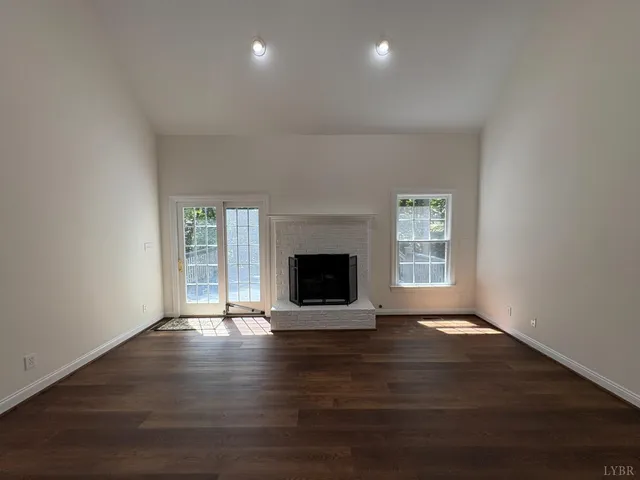 a spacious bathroom with a double vanity sink a large mirror and shower