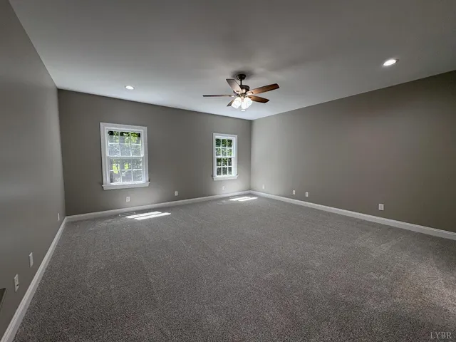 a view of room with walk in closet and window