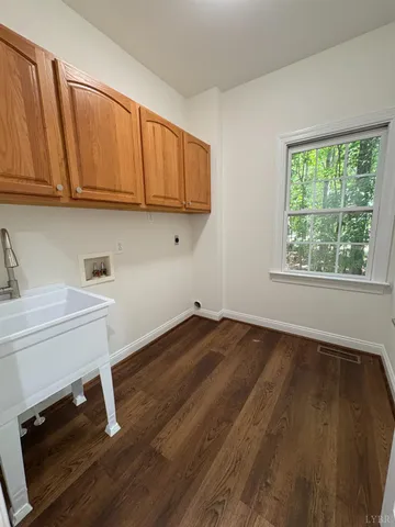 a view of a livingroom and a chandelier fan