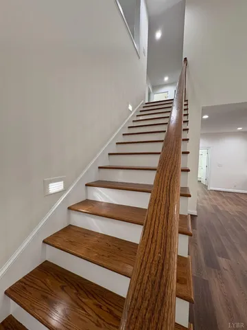 a large bathroom with a double vanity sink a large mirror and shower