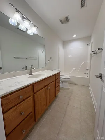 a view of an empty room with wooden walls