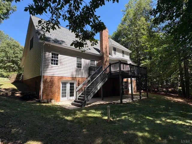 a view of a house with a tree in a yard