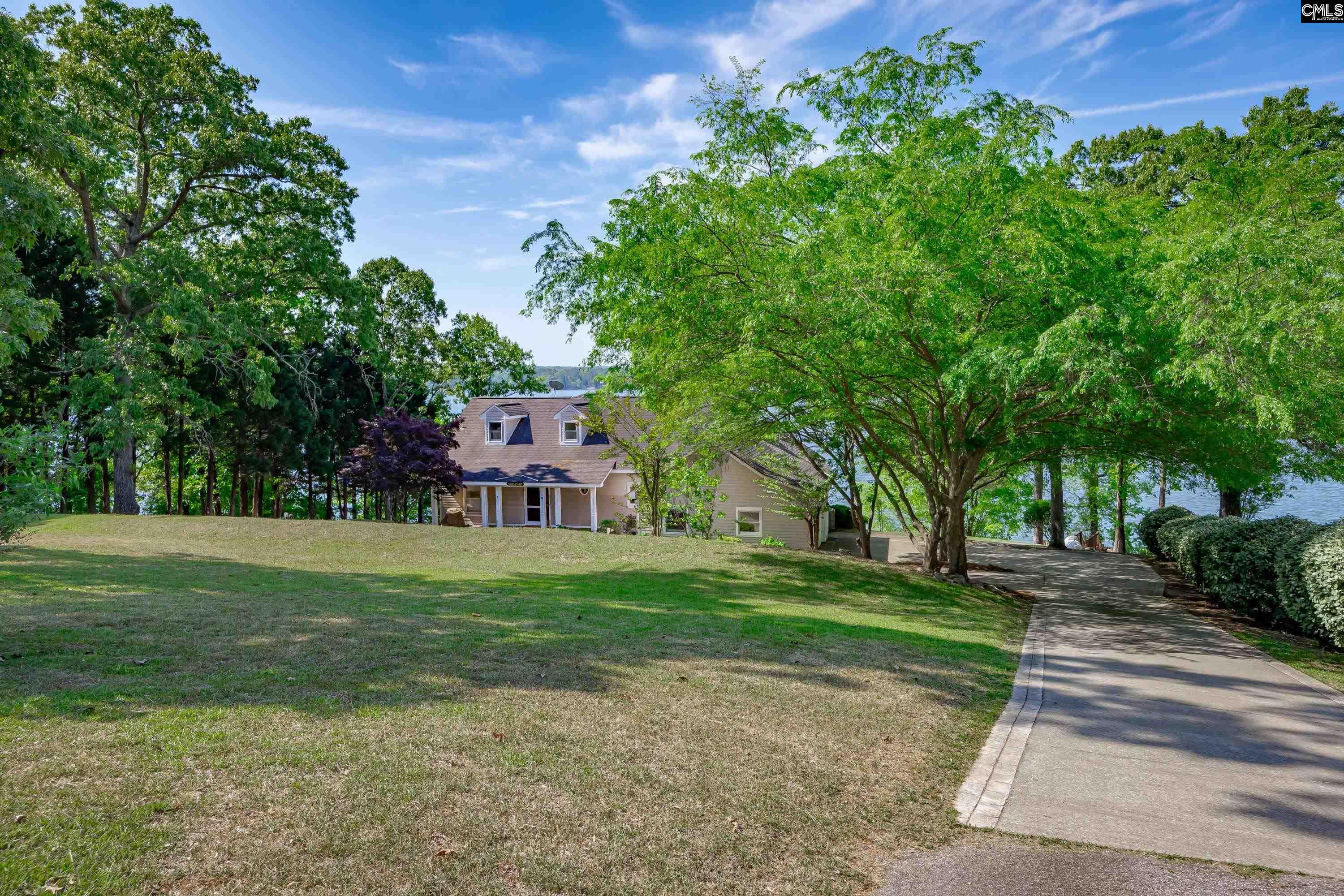 2577 Harbor View Road Camden, SC 29020 - Photo 6 of 42 a front view of a house with a yard