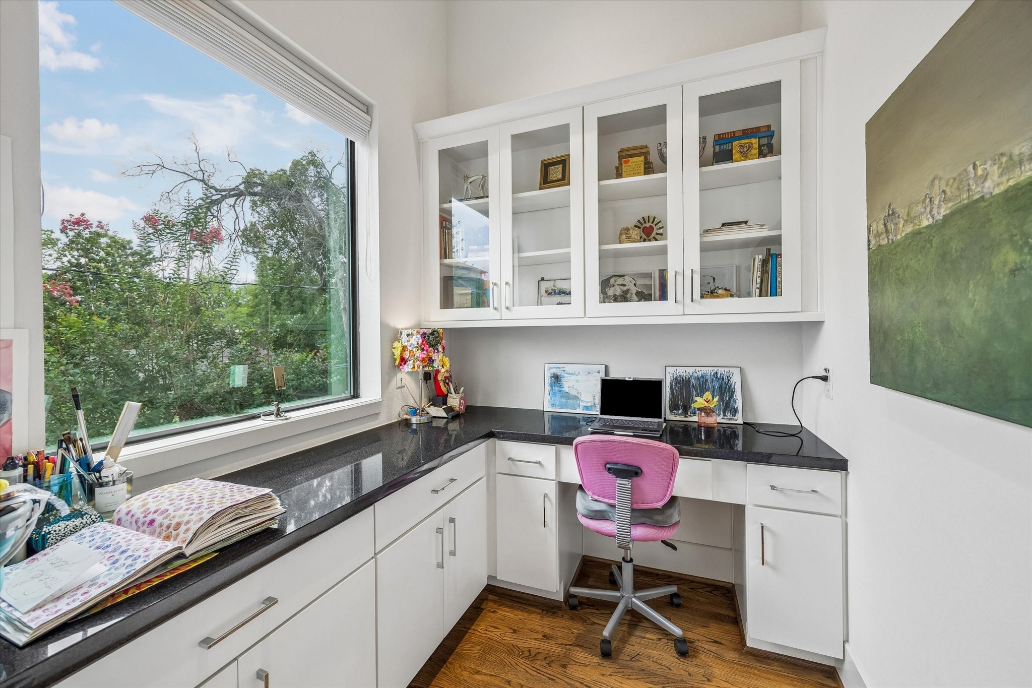 1526 Vermont Street Houston, TX 77006 - Photo 25 of 39 Built-in desk nook with upper cabinetry and workspace, ideal for working from home or everyday organization.