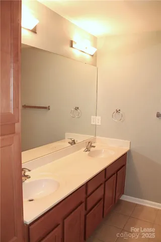 a bathroom with a sink and mirror