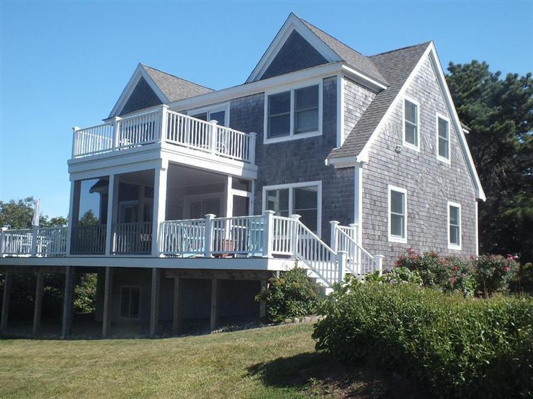 116 Castle Road Truro, MA 02666 - Photo 1 of 27 a front view of a house with a yard