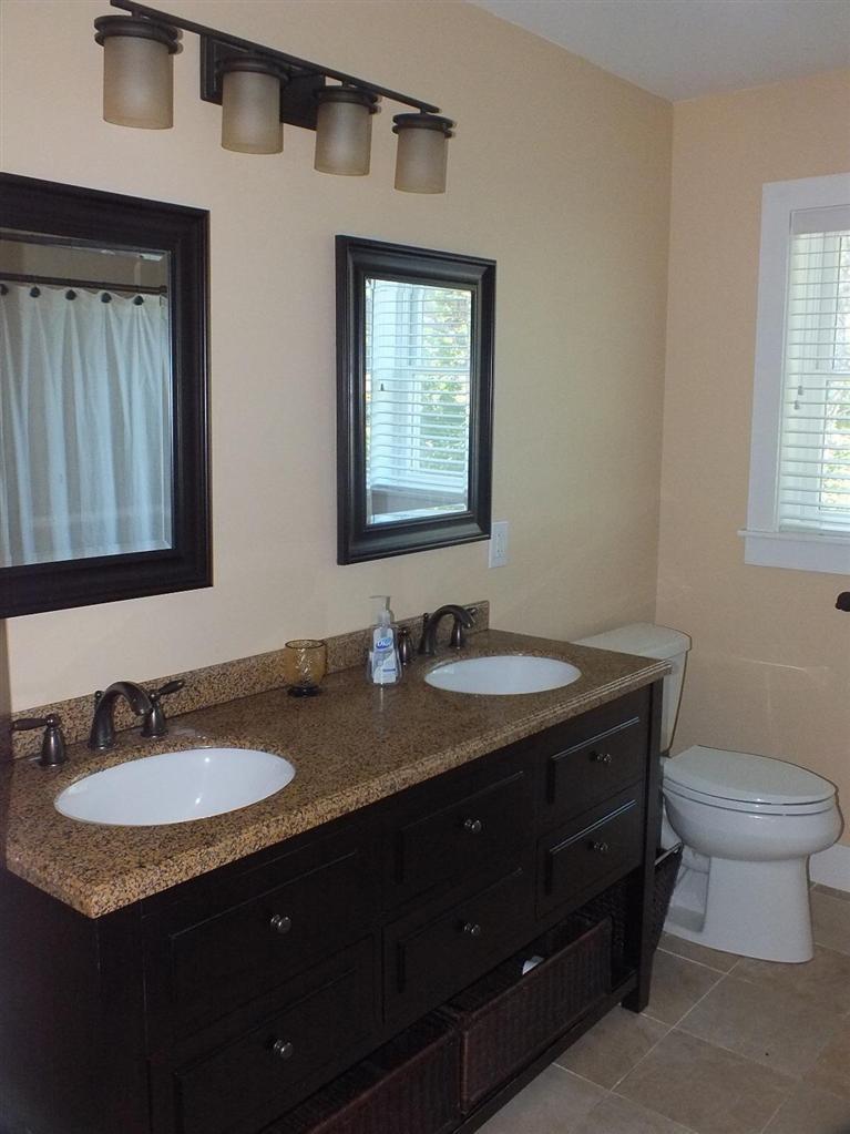 116 Castle Road Truro, MA 02666 - Photo 15 of 27 a bathroom with a granite countertop sink toilet and mirror