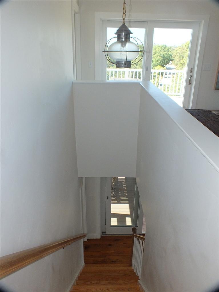 116 Castle Road Truro, MA 02666 - Photo 16 of 27 a view of empty room with wooden floor and fan